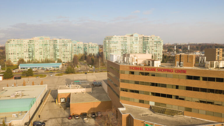 Aerial view of Thornhill Square Shopping Centre with surrounding residential buildings and commercial area in Thornhill, Ontario.