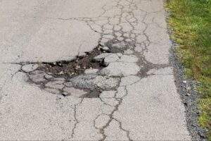 Asphalt driveway with alligator cracking